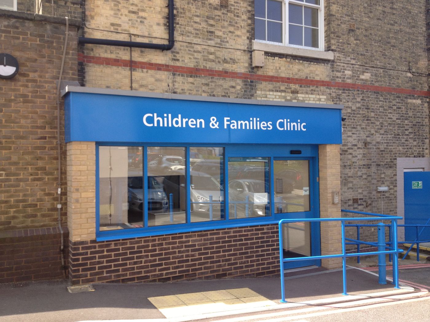 Single-storey entrance with a blue fascia reading Children & Families Clinic